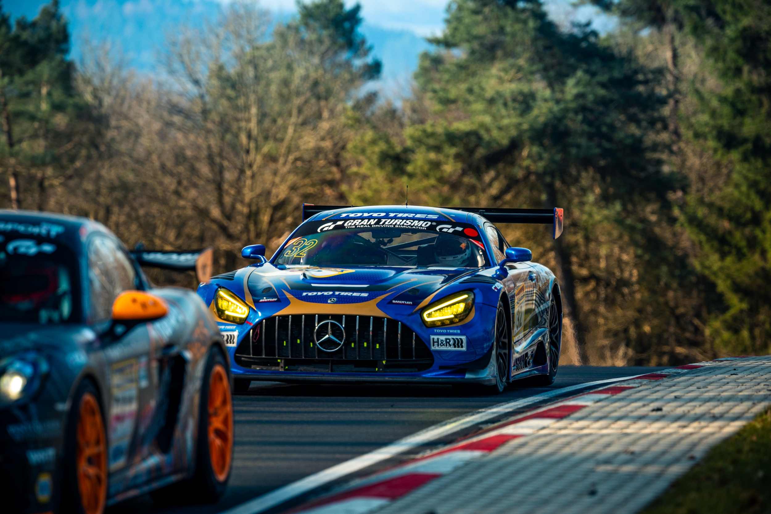 blue Toyo Tires race car Mercedes AMG on the Nürburgring race track